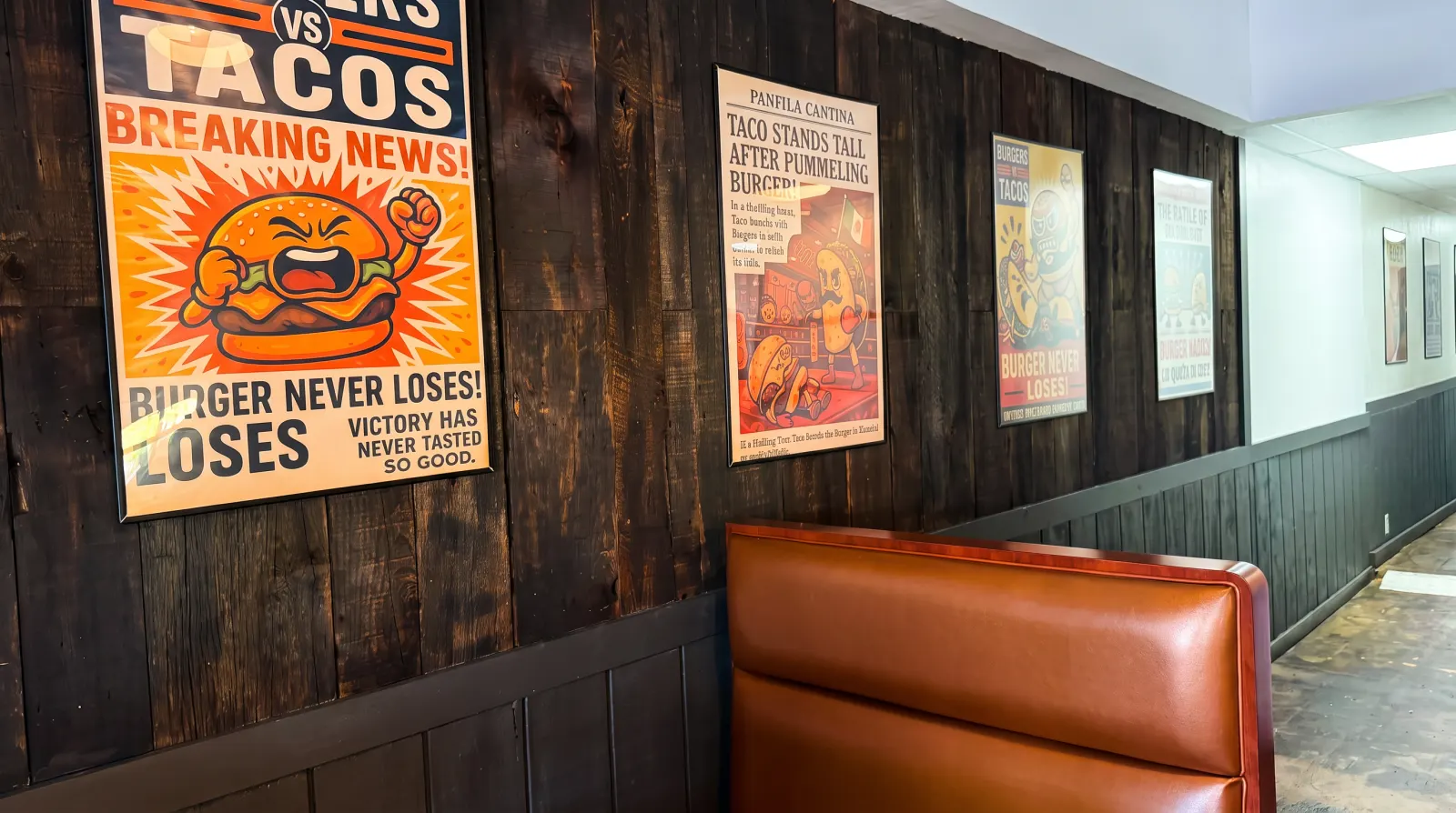 Wood wall with Burgers vs Tacos lucha libre posters